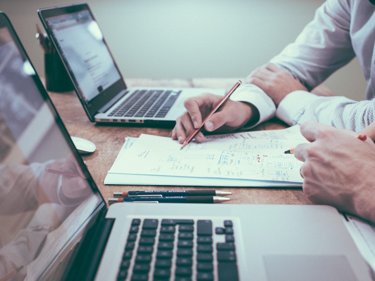 Advisors reviewing financial performance data